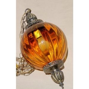 Two beautiful vintage amber glass hanging lights,